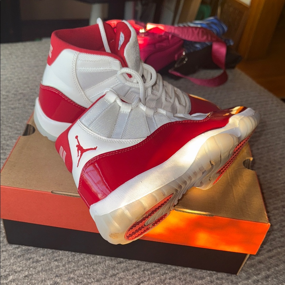 Jordan Cherry Red 11s High-Top Red and White Sneakers - Picture 3 of 9